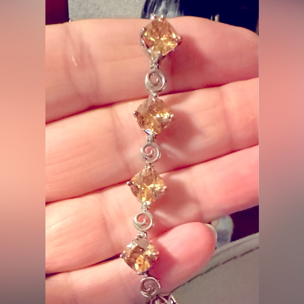 Silvertone bracelet with citrine color gems